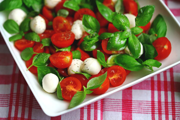 Caprese salad with mini mozzarella and cherry tomatoes. Italian Cuisine. Healthy food.