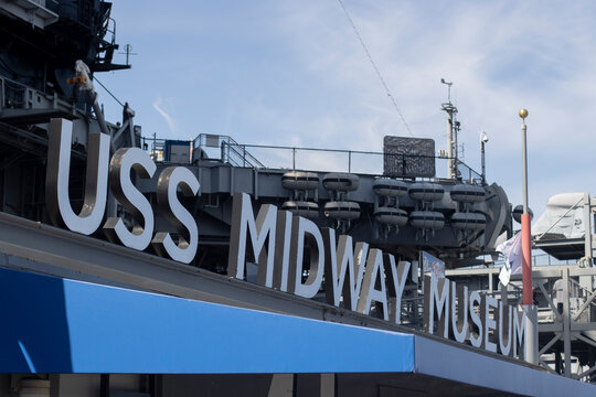 San Diego, CA, USA - Mar 25, 2022: Closeup of the USS Midway Museum sign seen at the entrance of the maritime museum in downtown San Diego, California at Navy Pier.