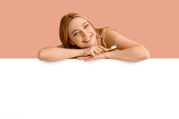 Fototapeta premium Beautiful mature woman with tooth brush and poster on color background