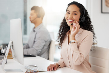I always prioritise the customer. Portrait of a young call centre agent working on a computer in an...