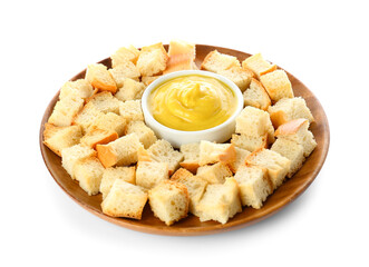 Plate with crunchy croutons and sauce isolated on white