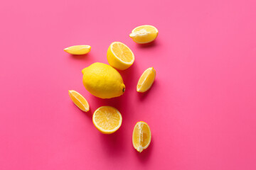Ripe lemons on pink background, top view