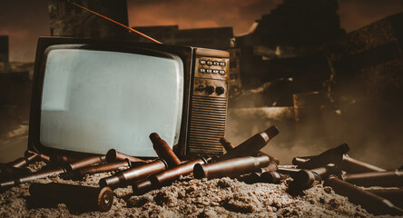 3d render artwork illustration of old fashioned tv set standing on sand hill with bullet shells on destroyed city battlefied or war background.