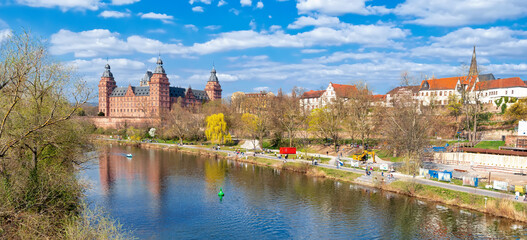 Aschaffenburg, the river Main with shore promenade and castle in springtime. Schloss Johannisburg