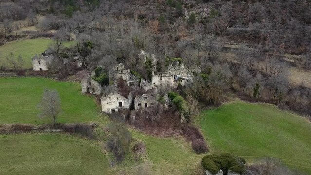 Aerial image of the abandoned town of "Santa Olaria de Ara" in the province of Huesca, Spain. The ruins have been absorbed by nature.