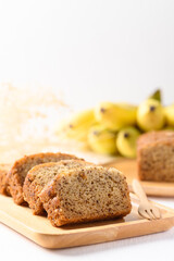 Banana bread on wooden plate with fork ready to eating