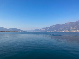 Bergamo, Italy: 10-02-2022: Panoramic of Lake Iseo, the fourth largest lake in Lombardy, Italy, fed by the Oglio River.