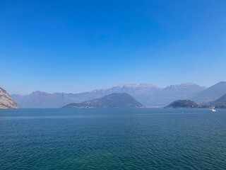 Fototapeta premium Bergamo, Italy: 10-02-2022: Panoramic of Lake Iseo, the fourth largest&nbsp;lake&nbsp;in&nbsp;Lombardy, Italy, fed by the&nbsp;Oglio River.