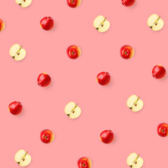 Creative pattern made of apple on pink background. Flat lay. Food concept.