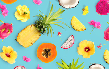 Creative layout made of tropical fruits and flowers. Flat lay. Food concept. Macro concept....