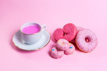 breakfast  with pink donut and pink coffee on pink background