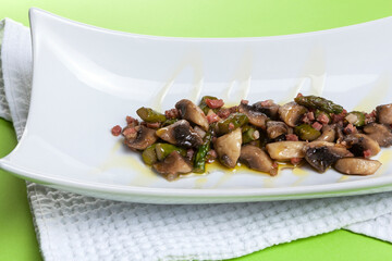 mushroom scrambled eggs with plated green asparagus