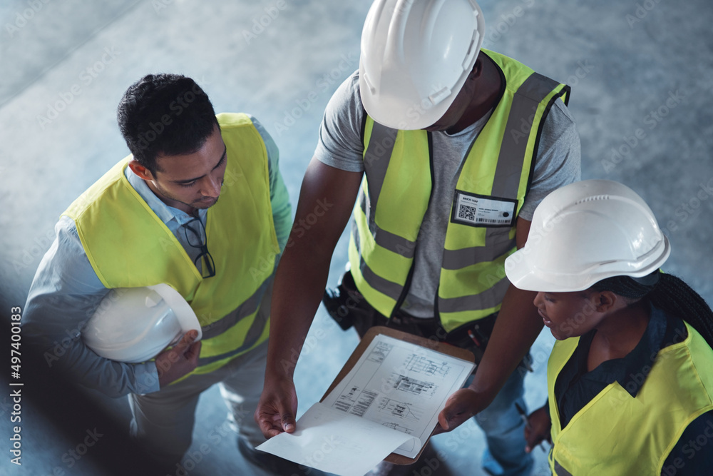 Poster weve got to arrange these perfectly. high angle shot of a group of contractors standing in the wareh