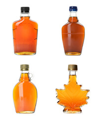 Set with bottles of tasty maple syrup on white background