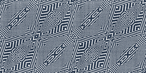 Seamless tribal ethnic indigo blue batik surface design pattern on rough linen, a trendy contemporary tileable abstract geometric shibori textile for interior decor and fashion.