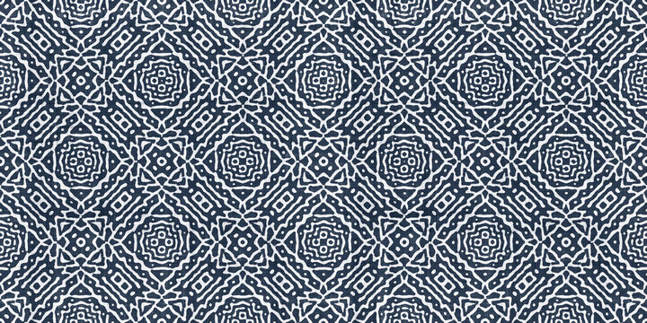 Seamless tribal ethnic indigo blue batik surface design pattern on rough linen, a trendy contemporary tileable abstract geometric shibori textile for interior decor and fashion.