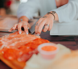hands cutting food Spain dinner ham 
