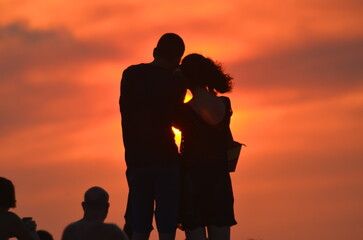 Fototapeta na wymiar Sunsets awesome, different persons taking selfie pic outside, lifestyle happiness in couple