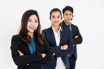 Group of Asian call center or IT support with headphone in arms crossed standing on white background. Corporate business team for teamwork concept. Customer after service.