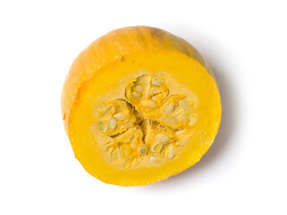 Cut yellow pumpkin on a white background. Studio photography. View from above