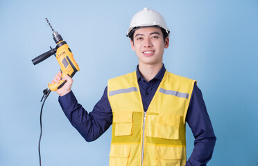 Construction worker portrait on blue background