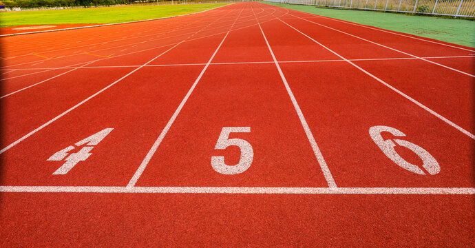Outdoor stadium. Treadmill  tracks for running in a street stadium, close-up. Competition concept, finish or start