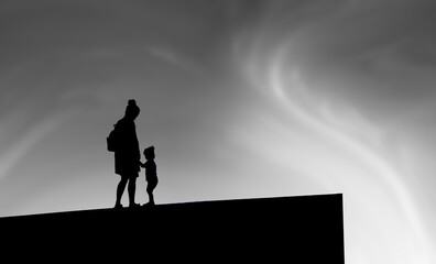 Naklejka na ściany i meble woman with child silhouette with clouds
