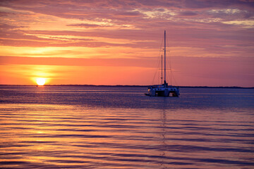 Sunset at sea landscape. Dramatic sunset sky with clouds. Dramatic sunset over the sea. Summer and blue sky with blue sea waves soft surface and beauty sunset.