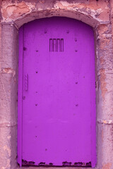 velvet violet dungeon door. concept of enclosure. copy space.