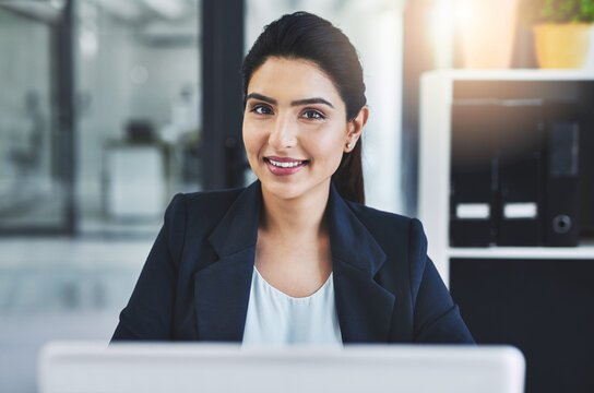 Put In The Work, Reap The Rewards. Cropped Shot Of An Attractive Young Businesswoman In Her Office.