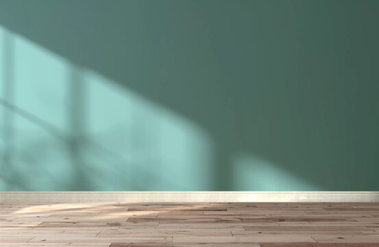 Empty room with blank teal green wall and parquet wood floor with sun light and trees and leaves shadow. 3D render for product display background and interior design and decoration
