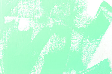 Green pattern of color paint brush on the white wall.