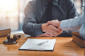 Businessman handshake partner lawyers or attorneys discussing a contract agreement. Business people shaking hands to congratulate success. - obrazy, fototapety, plakaty