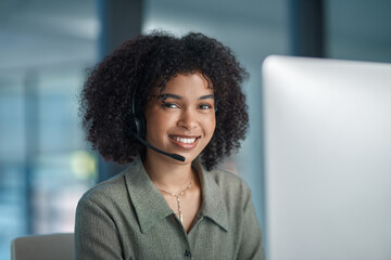 More smiling, less worrying. Shot of a young smiling female agent working in a call centre.