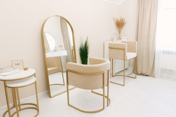 Beautiful bright interior of a beauty studio with a large mirror