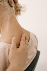 Massage and body care.  a woman in adulthood receives relaxing shoulder messages at the spa.