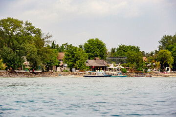White sand beach and boats in the water  on the  beautiful Gili Meno island, Bali, Indonesia
