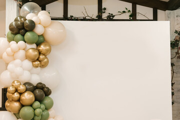 Rectangular photo zone with white, olive and golden balls