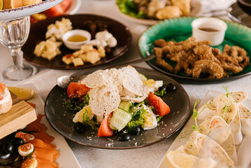 Festive table with food, buffet, bruschettas, cheese plate, fruits, selective focus