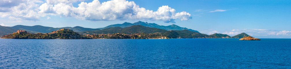 panorama of portoferraio with the fortress and the lighthouse, seen from the sea. - obrazy, fototapety, plakaty