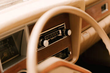Stylish details inside retro car, steering wheel and panel