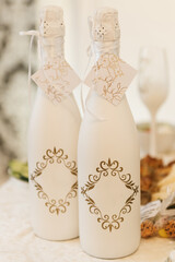 Event hall decor, wedding decor, white bottles for honeymooners