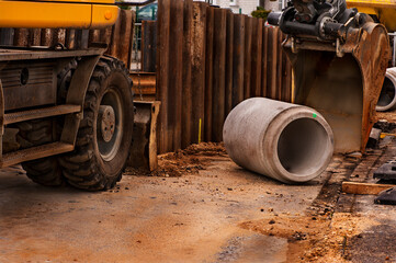 Installing new sewer pipes.
Big pipe or tube for water sewer on construction site during road repair
