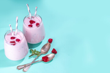 Raspberry smoothie, milkshake or yogurt. Fresh raw organic berry drink in glasses