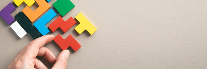 hand connecting geometric shape block