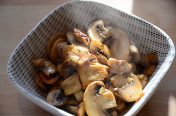 fried White organic Mushrooms. plant based cooking ingredients. vegan and vegetarian cuisine. food preparation