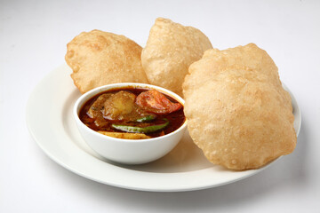 Aloo Puri or Potato curry with fried Poori, popular Indian breakfast / lunch / dinner menu.