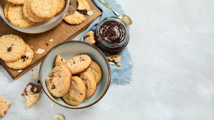 Delicious oat cookies on light background.