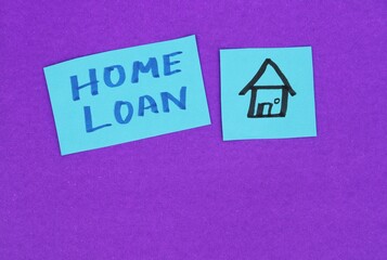 Home Loan Phrase with a Home or House Drawn on a Paper Piece Isolated on Blue Background with Copy Space