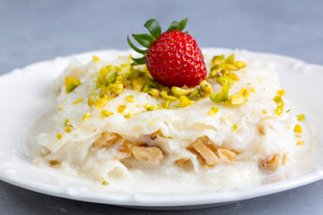 Close-up walnut gullac dessert. Traditional Ramadan dessert. Middle Eastern desserts.
